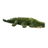 Green plush alligator toy on a white background