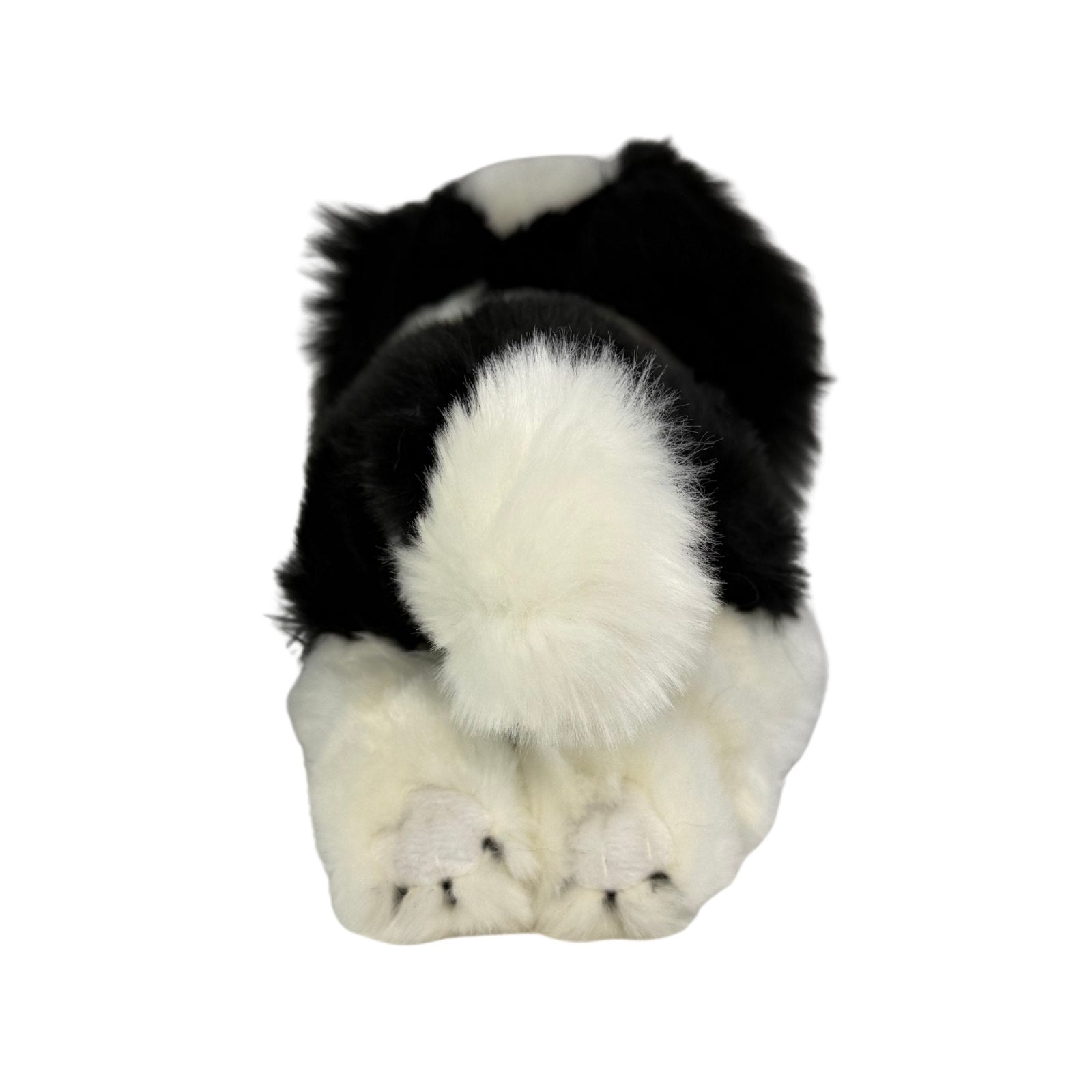 a really cute handmade realistic plush puppy in a lying position