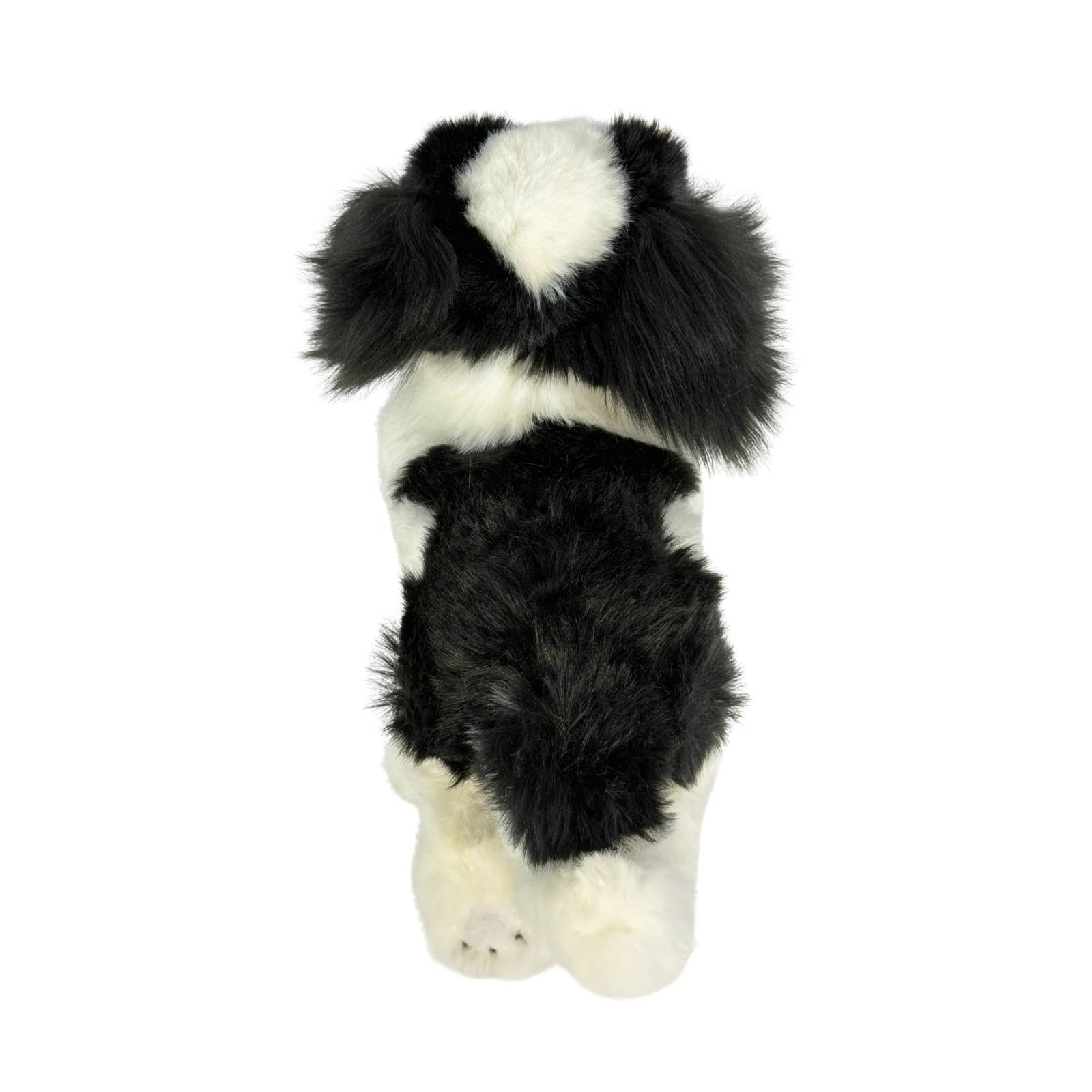 a really cute handmade realistic plush puppy in a lying position