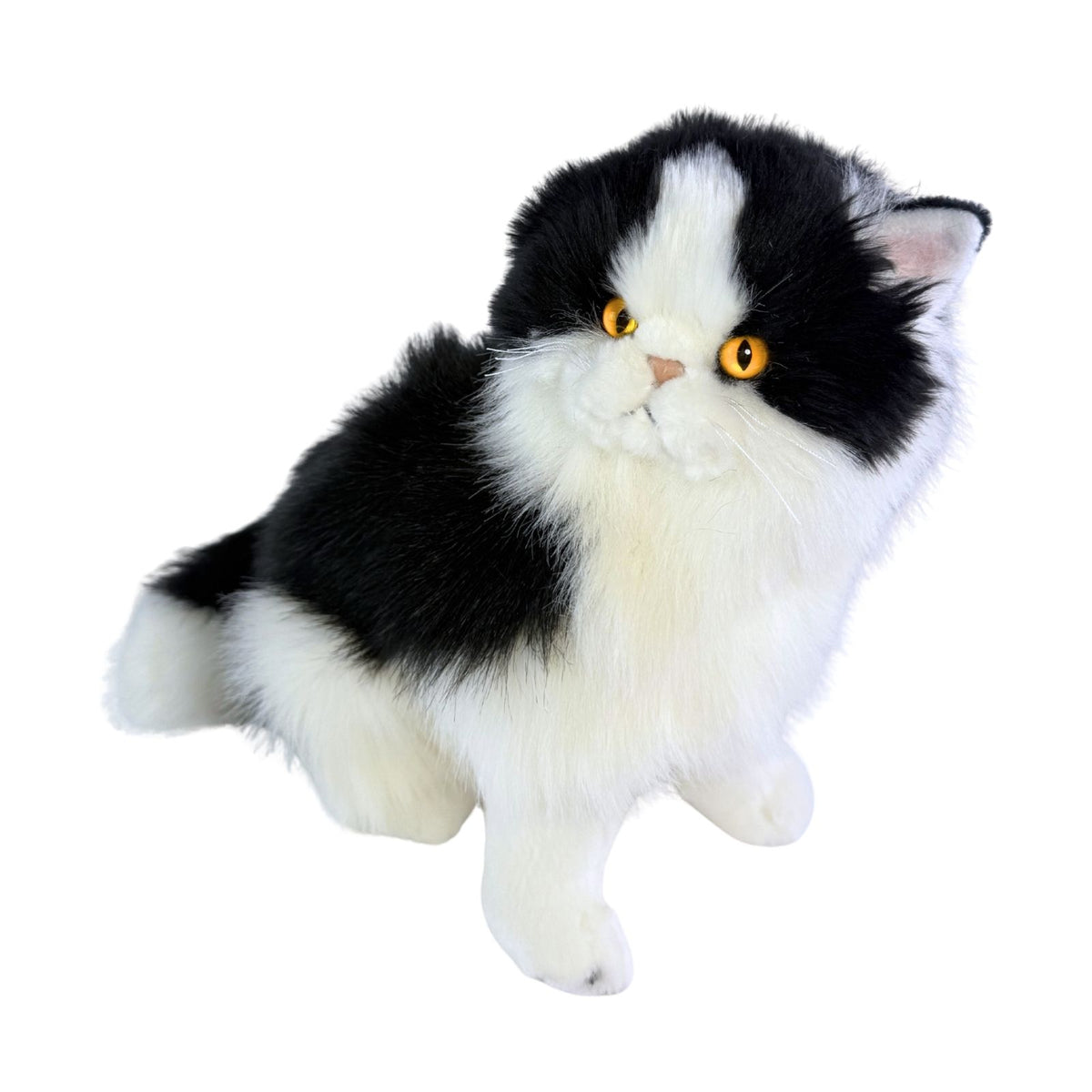 a sitting Piebald cat in white and black colour and is a realistic soft plush toy