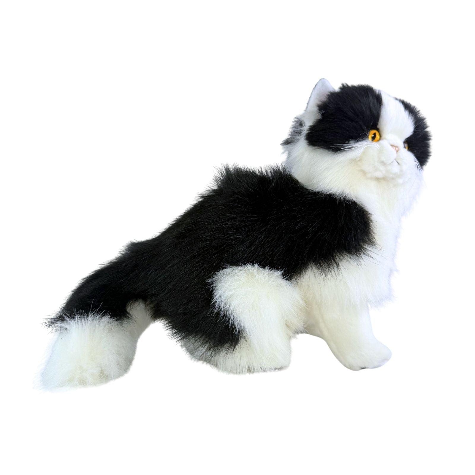 a sitting Piebald cat in white and black colour and is a realistic soft plush toy