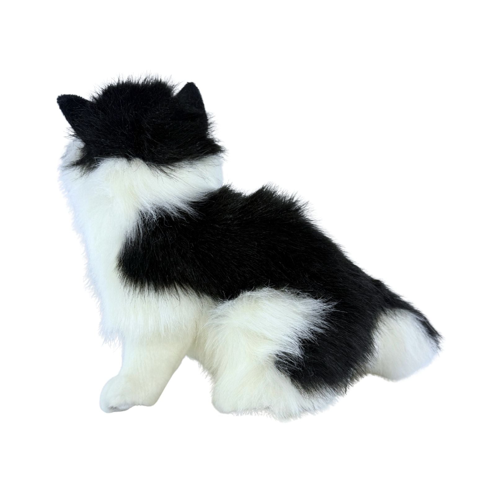 a sitting Piebald cat in white and black colour and is a realistic soft plush toy
