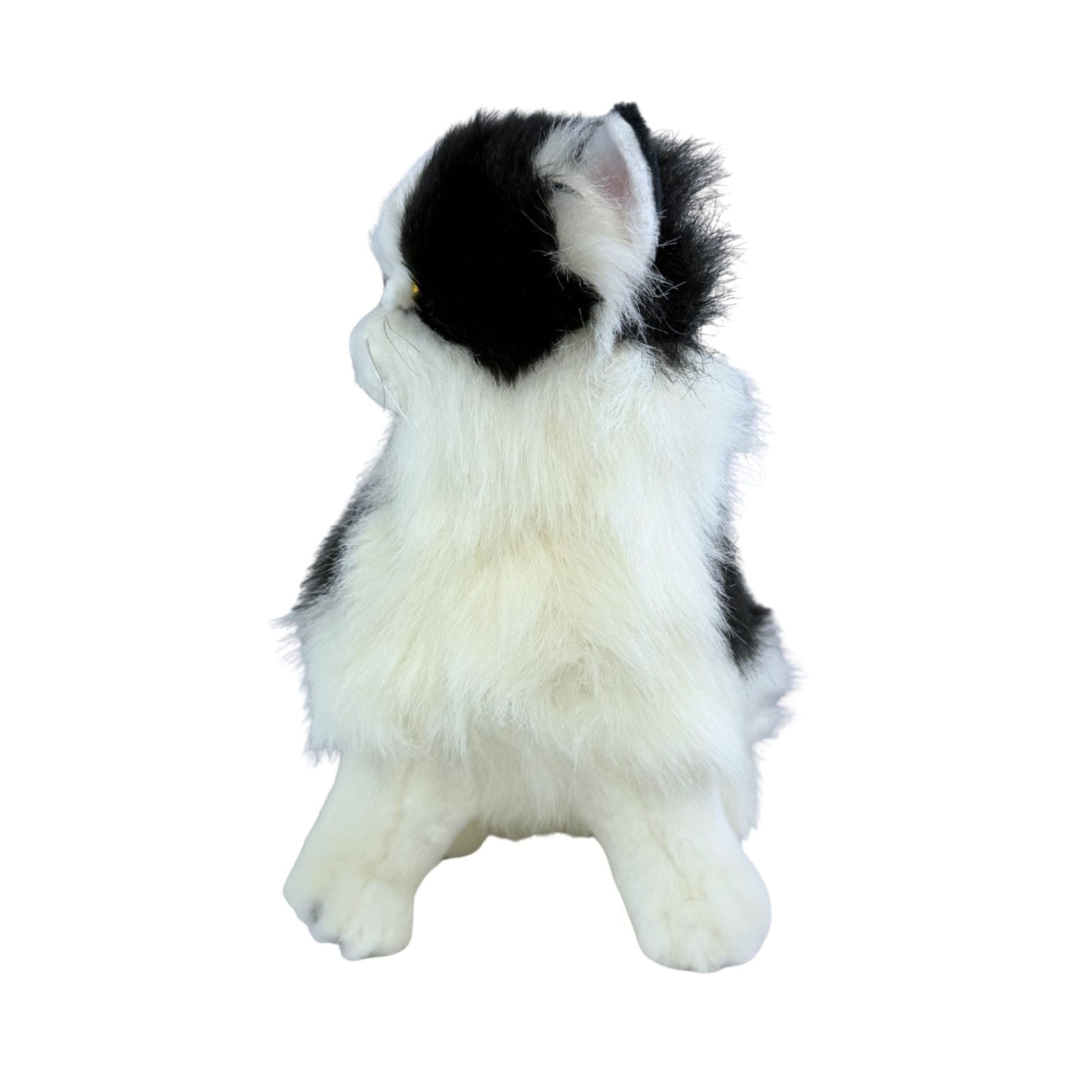 a sitting Piebald cat in white and black colour and is a realistic soft plush toy