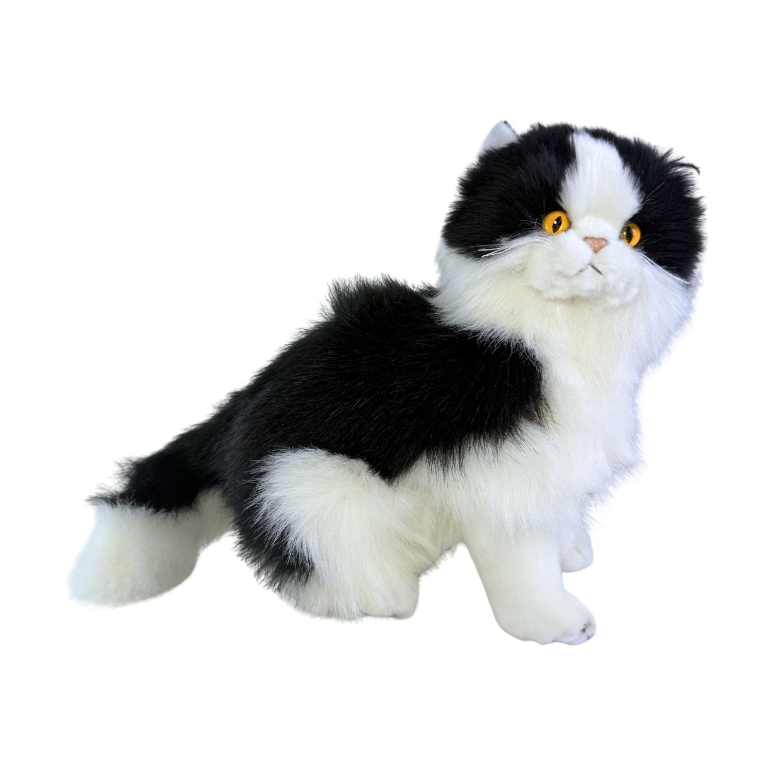 a sitting Piebald cat in white and black colour and is a realistic soft plush toy
