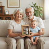 Grandparents and baby holding knitted koala wooden baby teether ring in gift box.