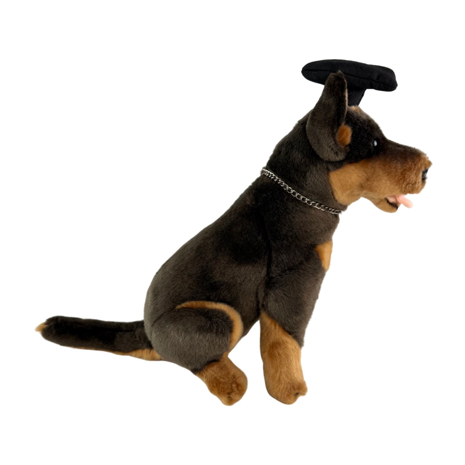 Side view of Basil Kelpie plush toy in graduation hat