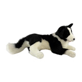 stuffed Border Collie plush toy in a lying position.