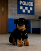 Koda Rottweiler plush sitting indoors