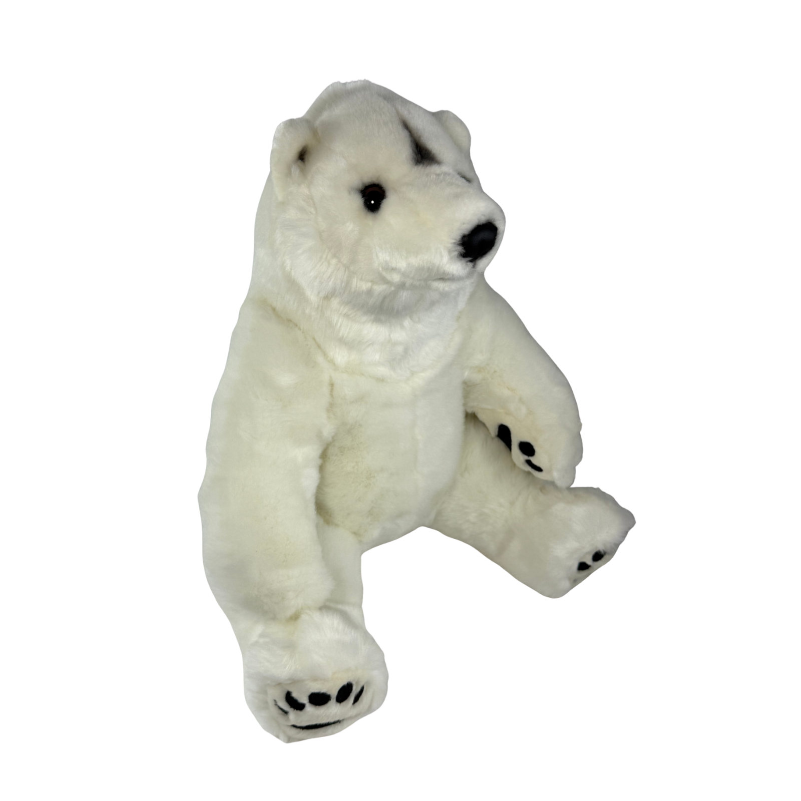Minka polar bear plush toy sitting angle view
