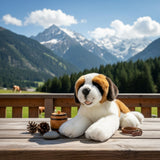 Mozart St. Bernard plush toy on wooden table with alpine mountains