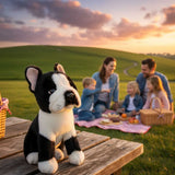 Pierre French Bulldog plush sitting on picnic table with family outdoors