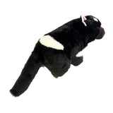 Black and white plush toy on a white background