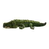 Green plush alligator toy on a white background