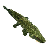 Plush toy alligator on a white background