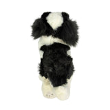 a really cute handmade realistic plush puppy in a lying position