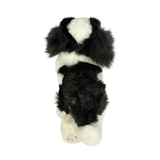 a really cute handmade realistic plush puppy in a lying position