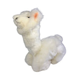 a charming white stuffed plush toy alpaca in a lying position