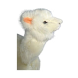 a charming white stuffed plush toy alpaca in a lying position