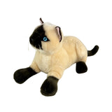 a crouching Siamese cat and is a realistic soft plush animal.