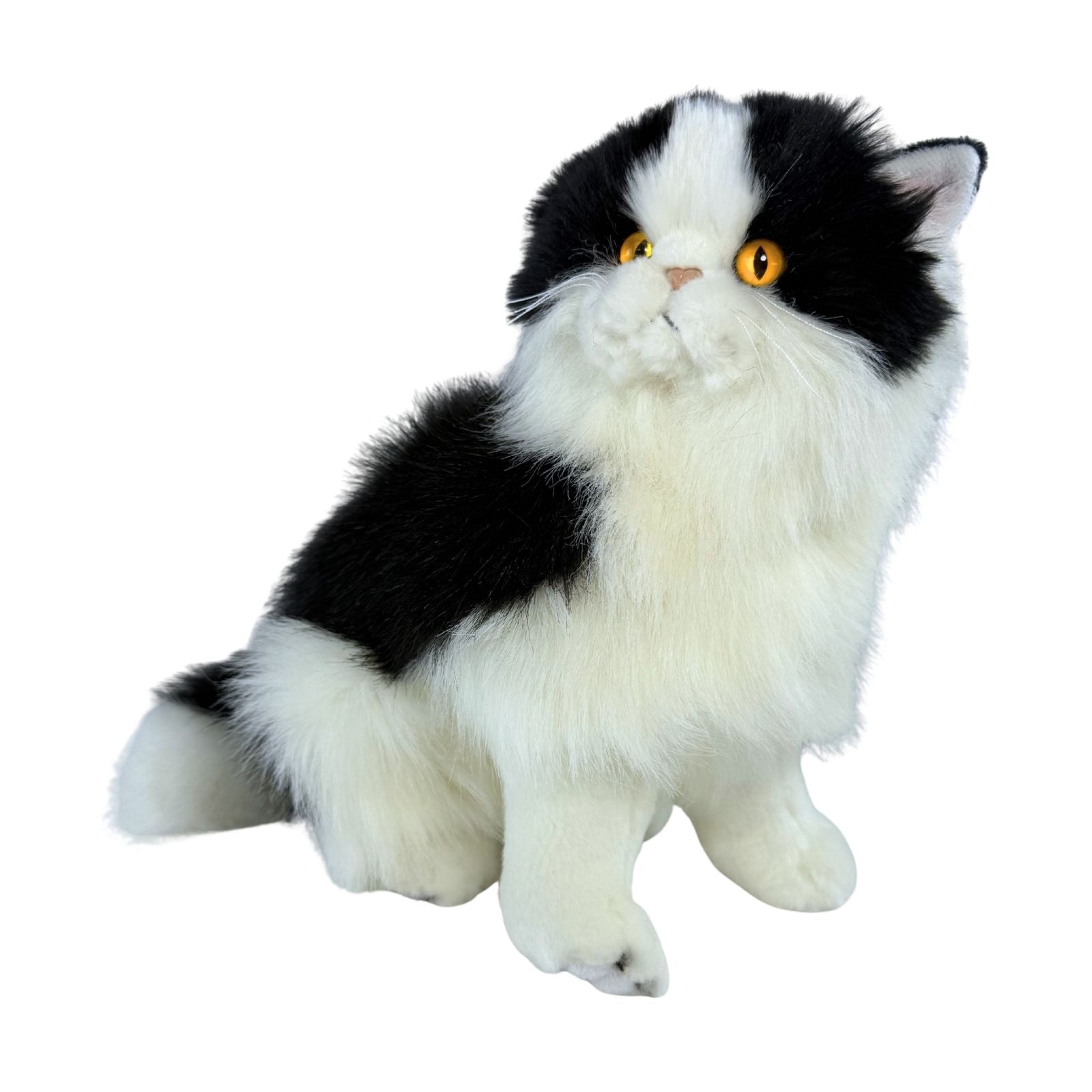 a sitting Piebald cat in white and black colour and is a realistic soft plush toy