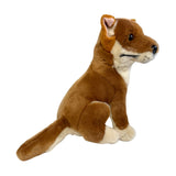 A brown realistic soft plush toy black and tan dingo in a sitting position