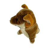 A brown realistic soft plush toy black and tan dingo in a sitting position