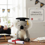 Athena Koala plush toy wearing a graduation hat