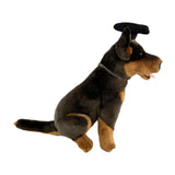 Side view of Basil Kelpie plush toy in graduation hat