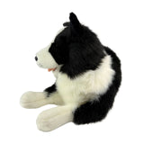 stuffed Border Collie plush toy in a lying position.