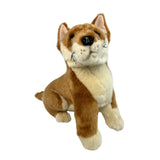 Plush toy dingo with brown and beige fur on a white background