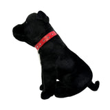 Side view of black Staffy dog plush toy sitting