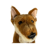 Plush toy head of a dingo with brown and black fur on a white background