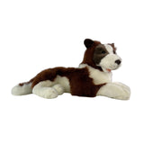 Side view of lying chocolate Border Collie plush toy