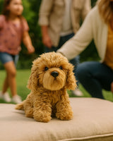 Sitting brown Oodle plush dog toy outdoors