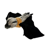 Plush toy resembling a bat with black wings and gray body on a white background