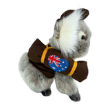 Sitting Jack koala plush with swag and hat side view