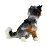 Plush toy resembling a dog with gray, white, and brown fur on a white background