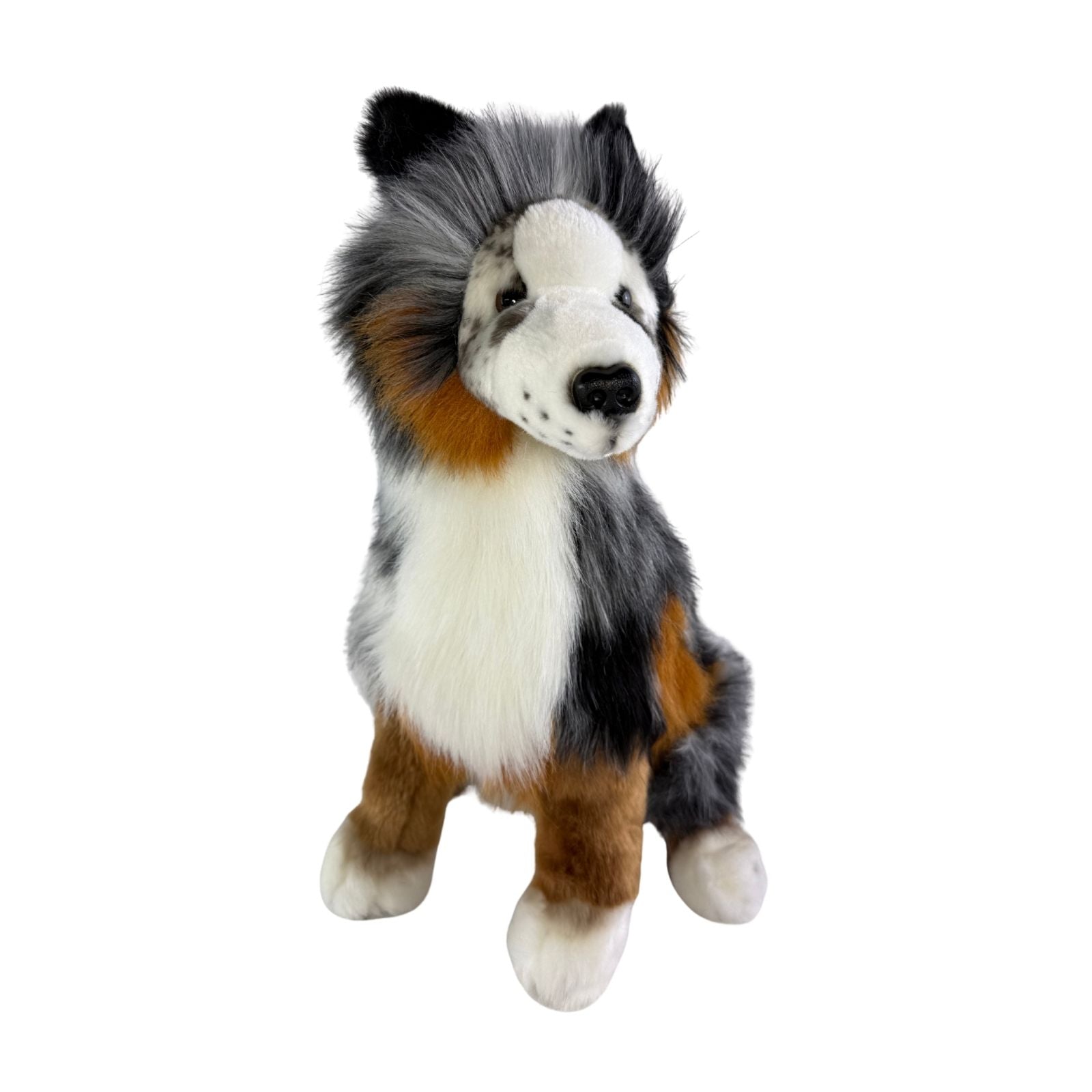 Plush toy resembling a dog with black, white, and brown fur on a white background