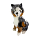 Plush toy resembling a dog with gray, white, and brown fur on a white background