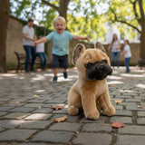 Paris French Bulldog plush sitting on cobblestone path