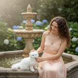 Pearl Persian cat plush sitting in a fountain