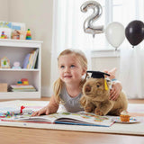 Tina wombat plush wearing graduation hat