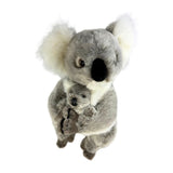 A gray and white plush koala stands holding a smaller joey in its arms.
